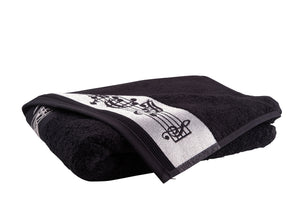 Zwarte handdoek met muzieknoten en G-sleutel